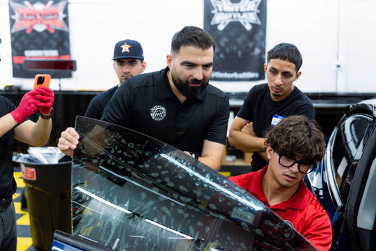 Window tint installation training on a real vehicle